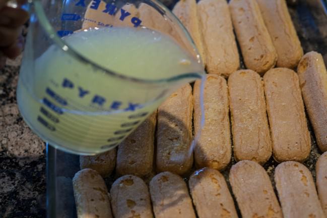 soaking the ladyfingers in limoncello