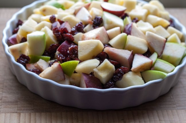 raw apples and cherries ready to bake