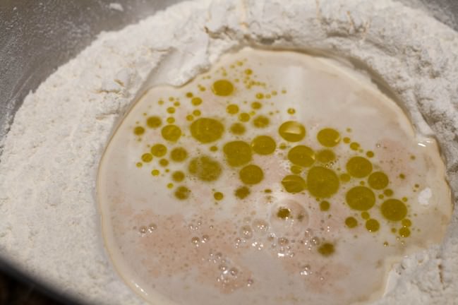 bubbly yeast and oil in well for pizza