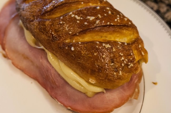 pretzel roll with ham an jarlsberg
