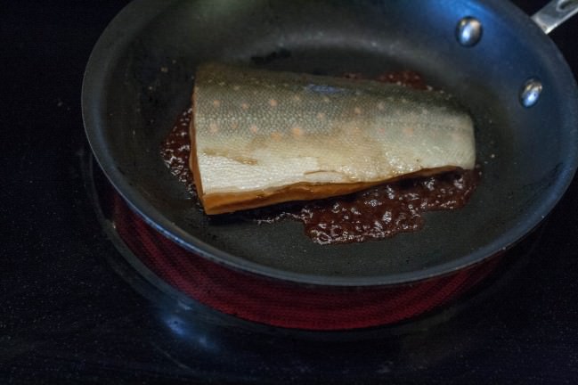 searing the salmon in bbq butter