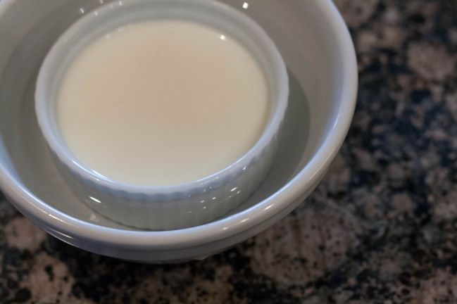 set panna cotta in a bowl of water