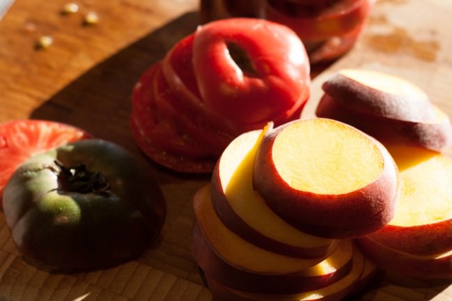 peaches and tomatoes in afternoon light