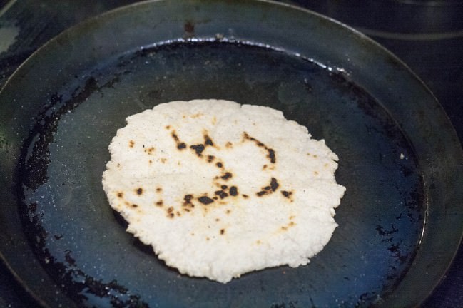 cooking a corn tortilla