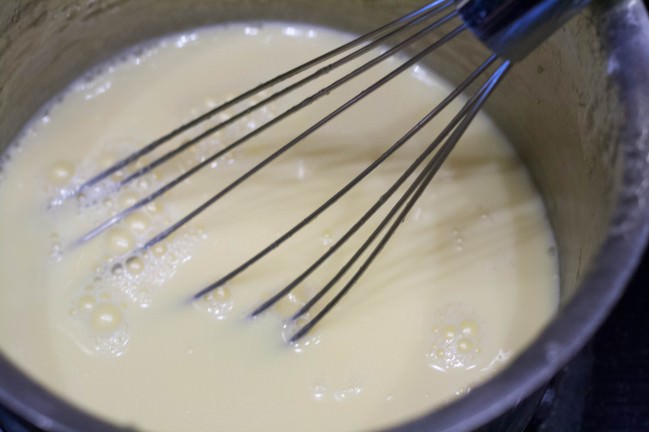 whising cream yolks and sugar