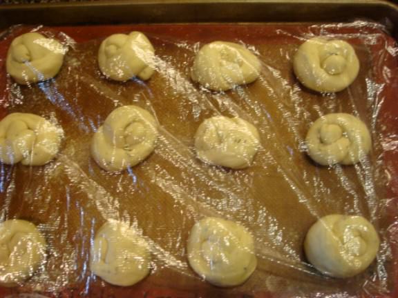 rosemary roll knots covered to rise