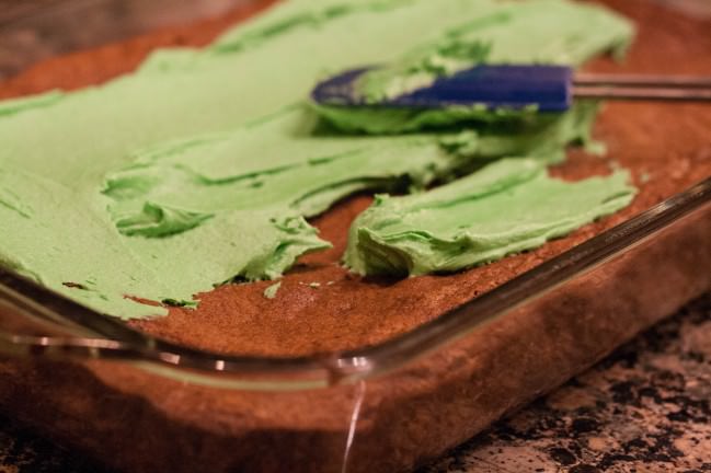 grasshopper brownies spreading mint frosting