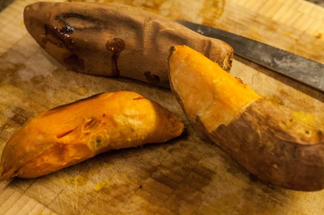 peeling the skin off sweet potatoes