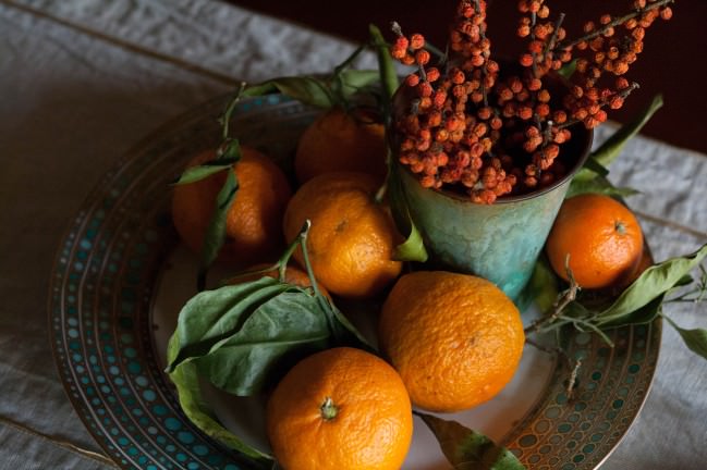 satsumas and orange berries above