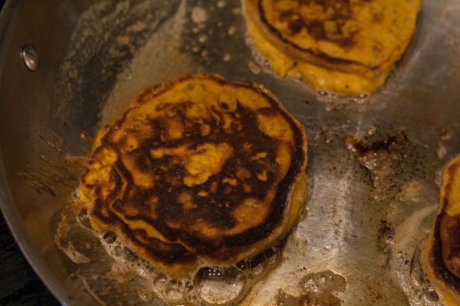 sweet potato pancakes on the griddle