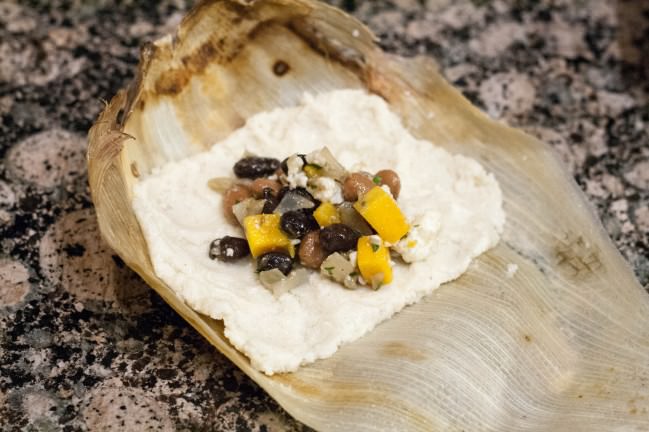 tamale dough with butternut filling in husk