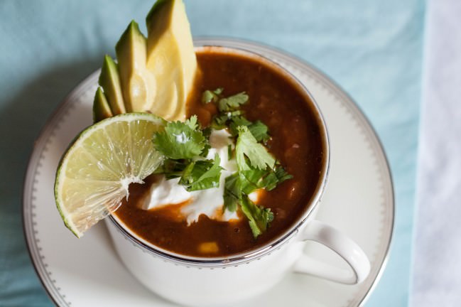 Kitchen Sink Black Bean and Ham Soup with avocado and sour cream