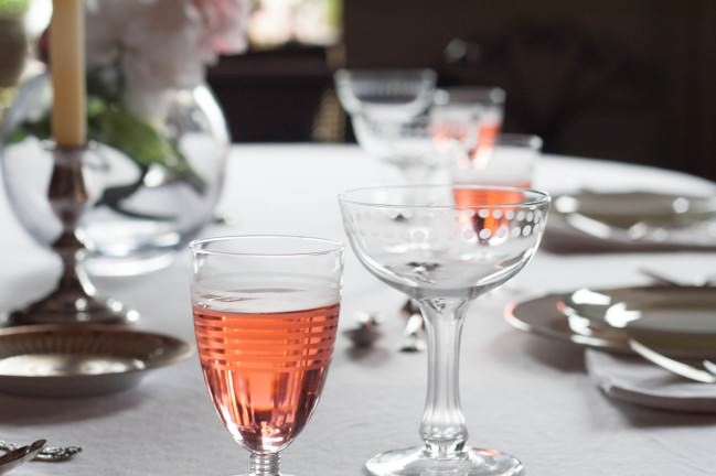 Peony Season Table Setting with French rose in French wine glasses