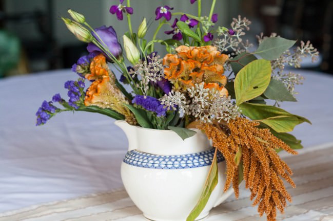 Fall Centerpieces in a blue and white pitcher