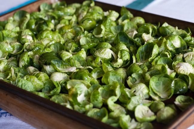 Runny Egg Pizza (Guanciale Béchamel) Brussels leaves with oil, salt and pepper