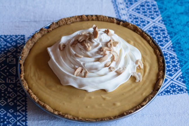 Pumpkin Butterscotch Pie with whipped cream and salted cashews