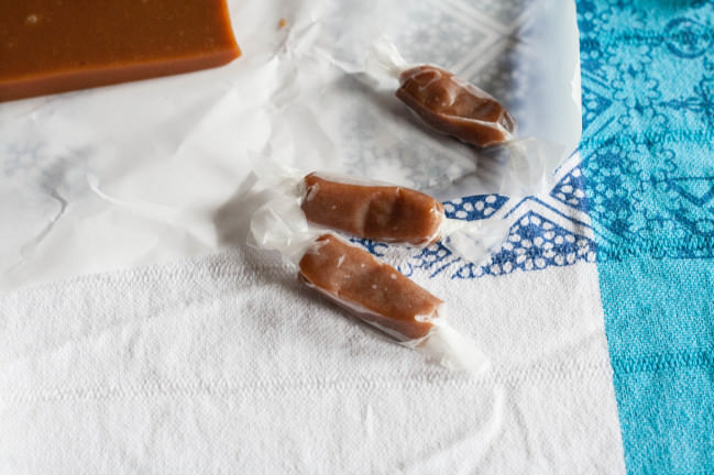 Sour Cherry Apple Cider Caramels wrapped in wax paper