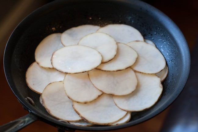 brunch with cedar kitchenette smoked salmon on potato pancake potato slices in pan