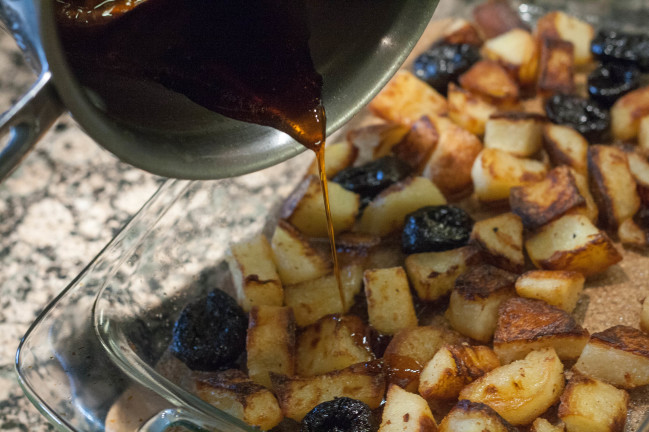 Duckfat Potatoes with Prunes pouring caramel