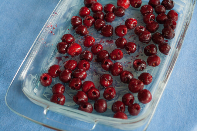 Baked German Cherry Almond Pancakes cherries in buttered pan